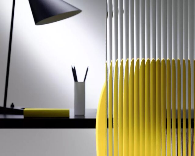 Clear reeded glass partition diffusing light in an interior setting